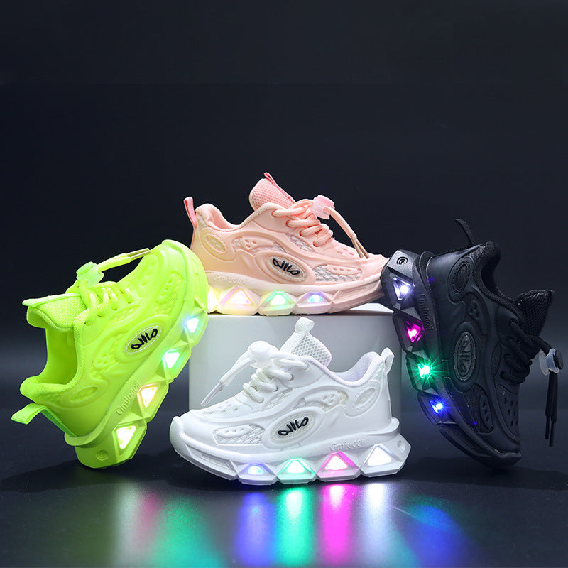 Four colorful sneakers with LED lights on a dark background