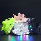 Four colorful sneakers with LED lights on a dark background